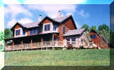 6x12 log home with timber frame porch.  Mixing wood and stone together.